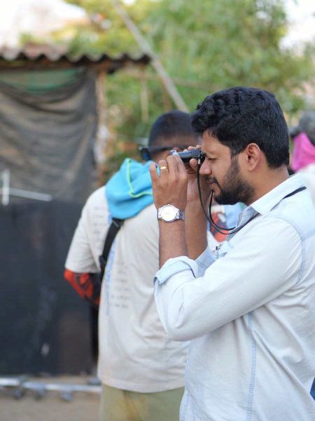 Tijo Thankachan checking frame on set