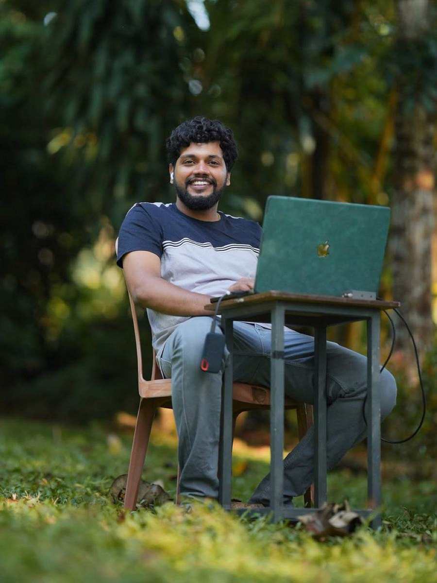 Tijo Thankachan editing on laptop during production