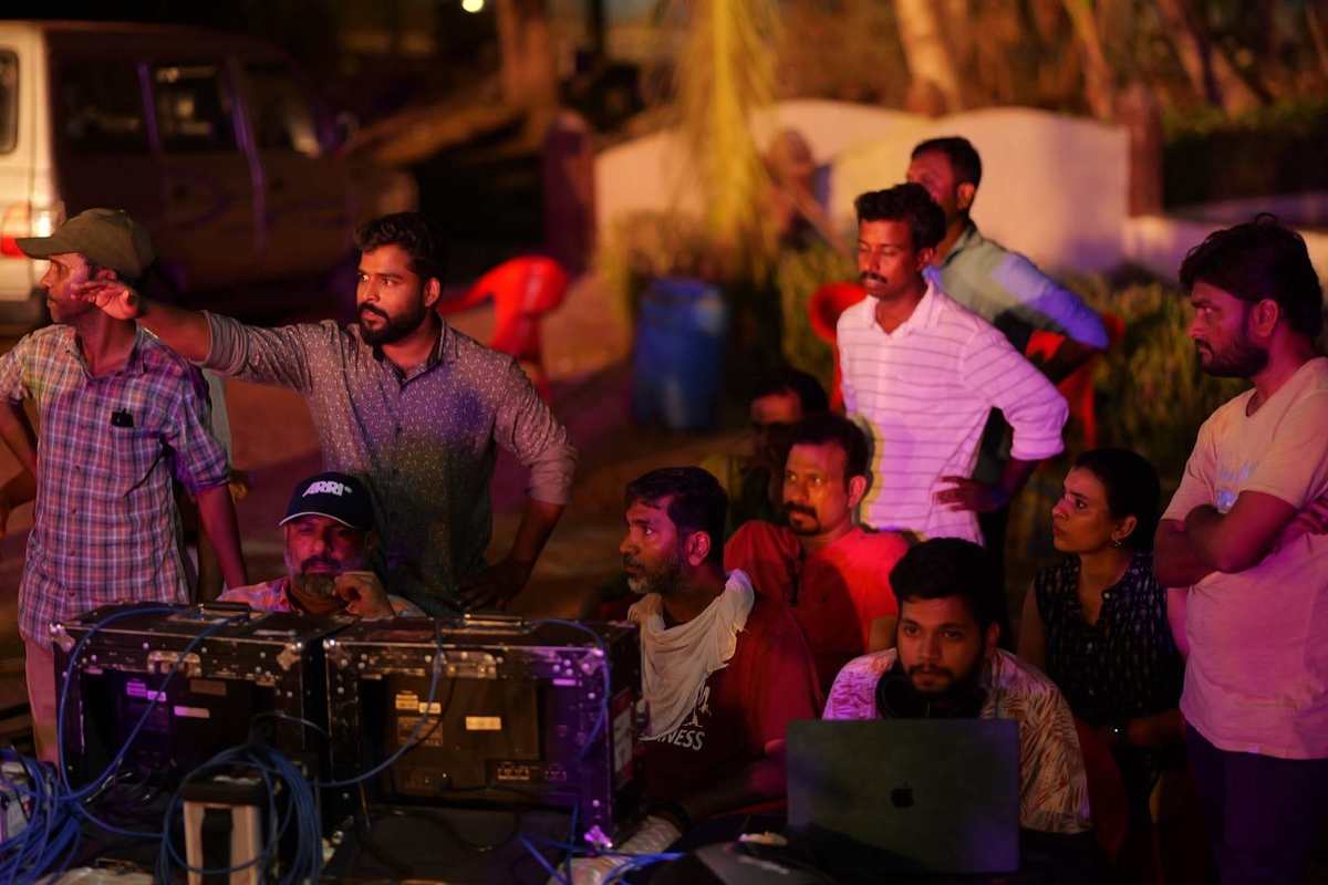 Production crew reviewing a scene